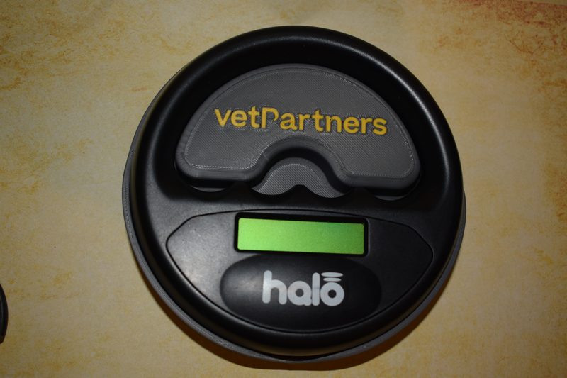 3D-printed Halo microchip reader holder, branded, with the reader docked